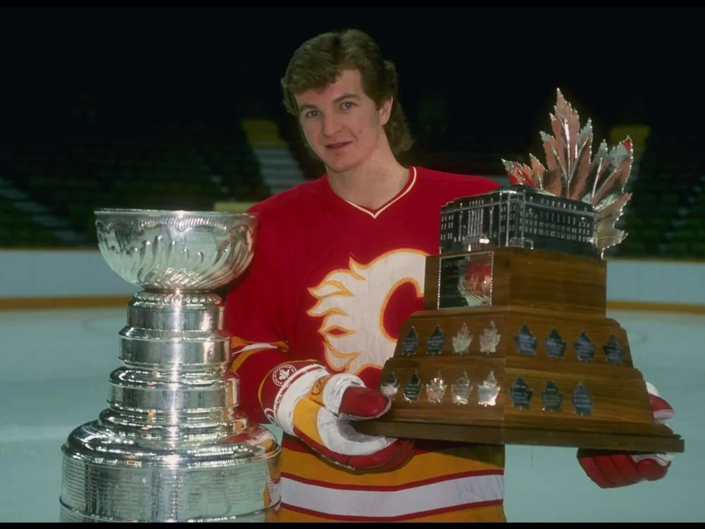 Flames forward scoring a crucial playoff goal against the opposing goalie during the 1989 Stanley Cup run