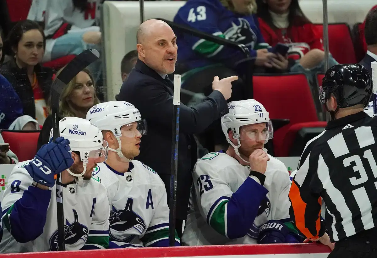 Graphic comparing Canucks home and road game distribution across the 2026–27 season with color-coded bars