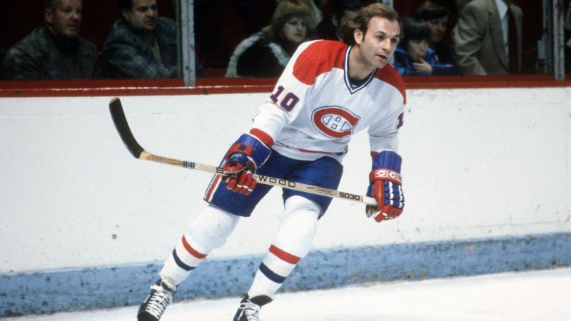 Lafleur accelerating past a defender while controlling the puck, highlighting his speed and stickhandling