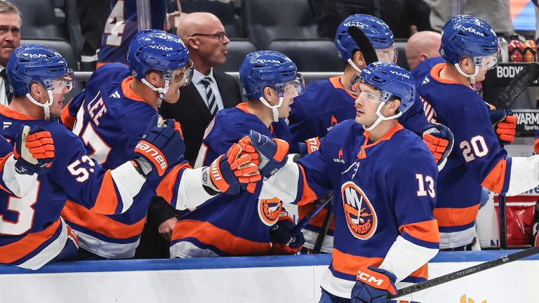 Timeline of New York Islanders uniforms showing shifts in navy, orange and white across decades